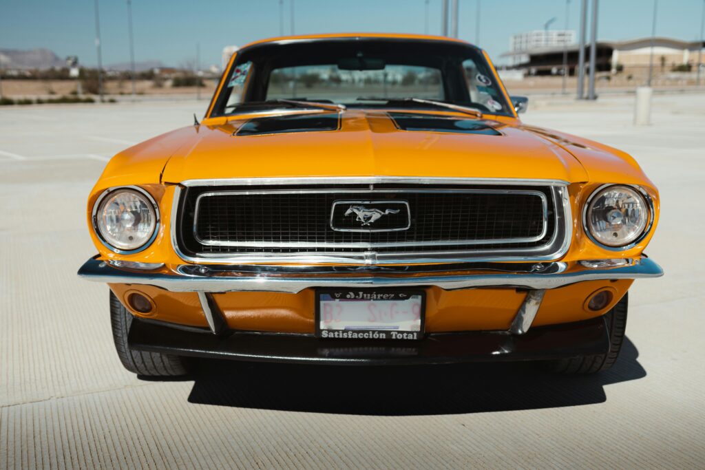 Classic orange Ford Mustang photographed in Los Angeles on a sunny day.